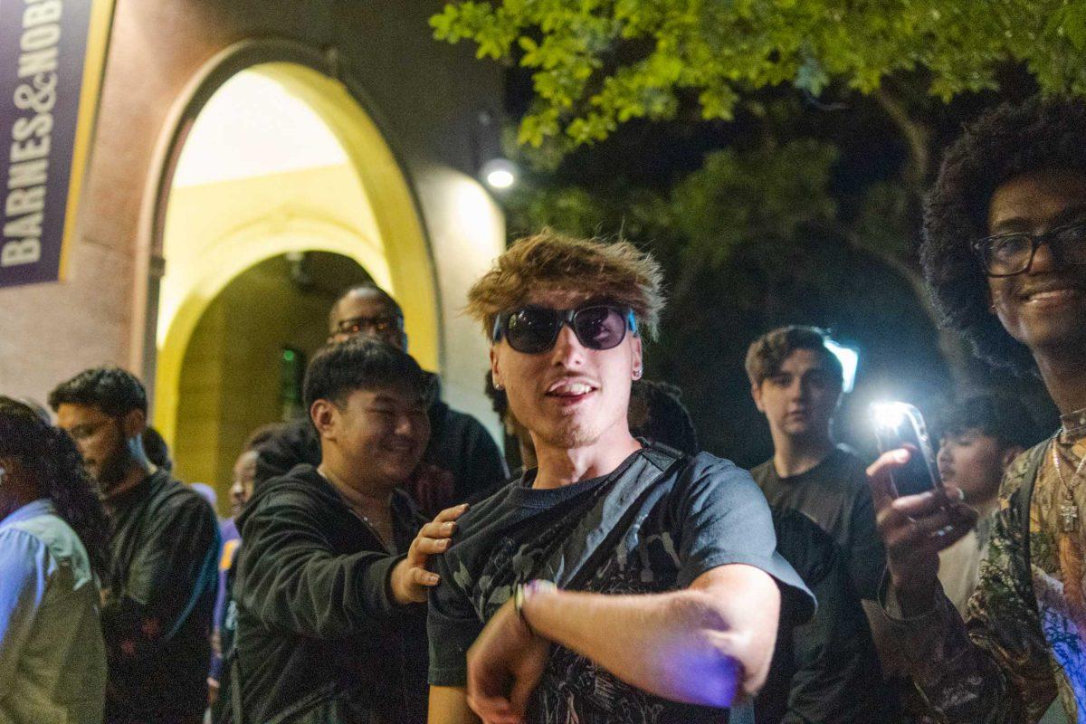 LSU accounting freshman Hayes Vidrine dances to music Wednesday, April 3, 2024, while waiting for the Travis Scott clothing launch at the Barnes &amp; Nobles at LSU.