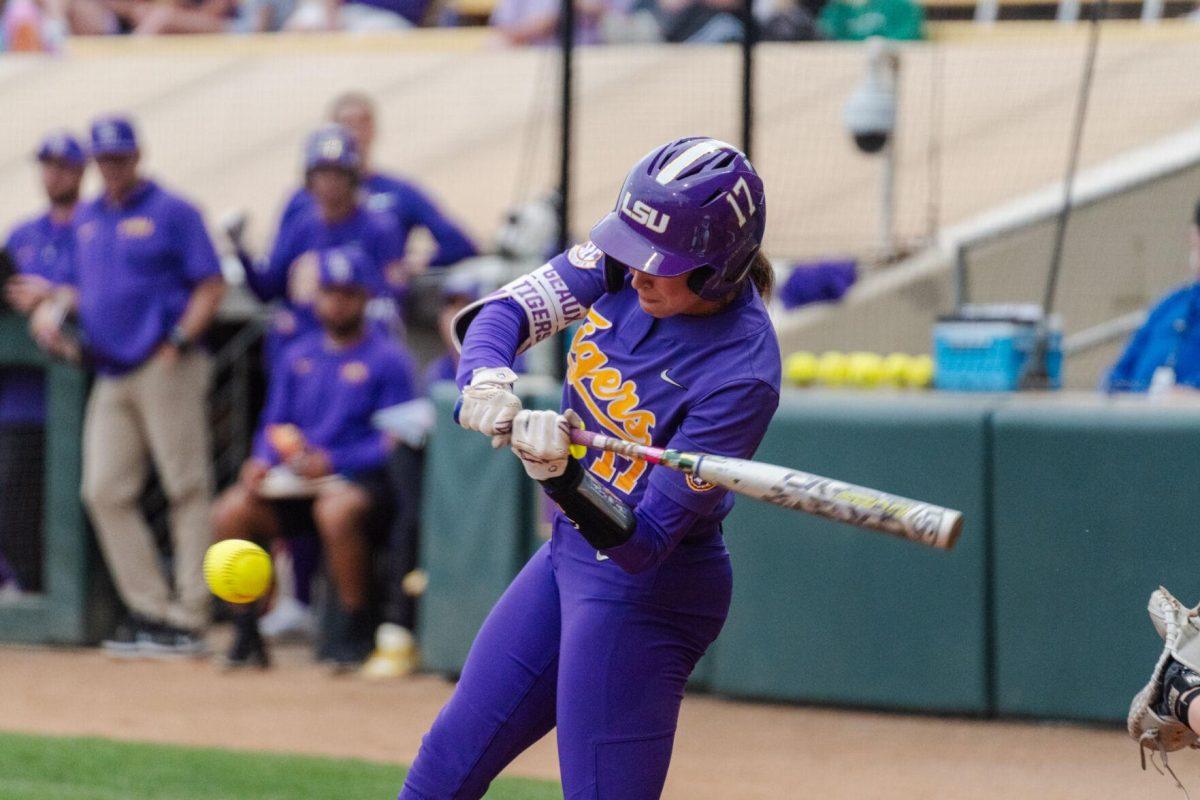 LSU softball graduate student infielder Taylor Pleasants (17) swings for the ball Tuesday, April 2, 2024, during LSU's 7-4 win against ULM in Tiger Park in Baton Rouge, La.