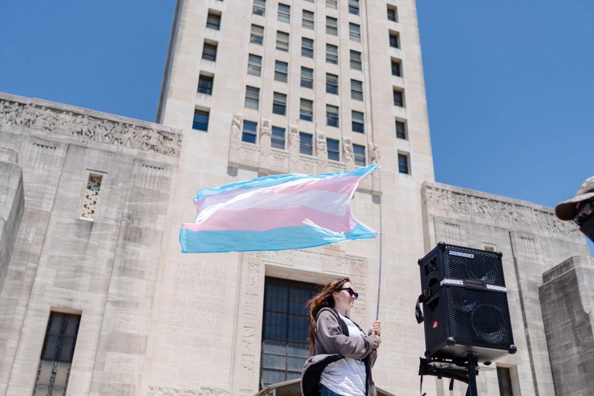 A trans flag flies in the wind Monday, April 22, 2024, during a protest at the Lousiana State Capitol in Baton Rouge, La.