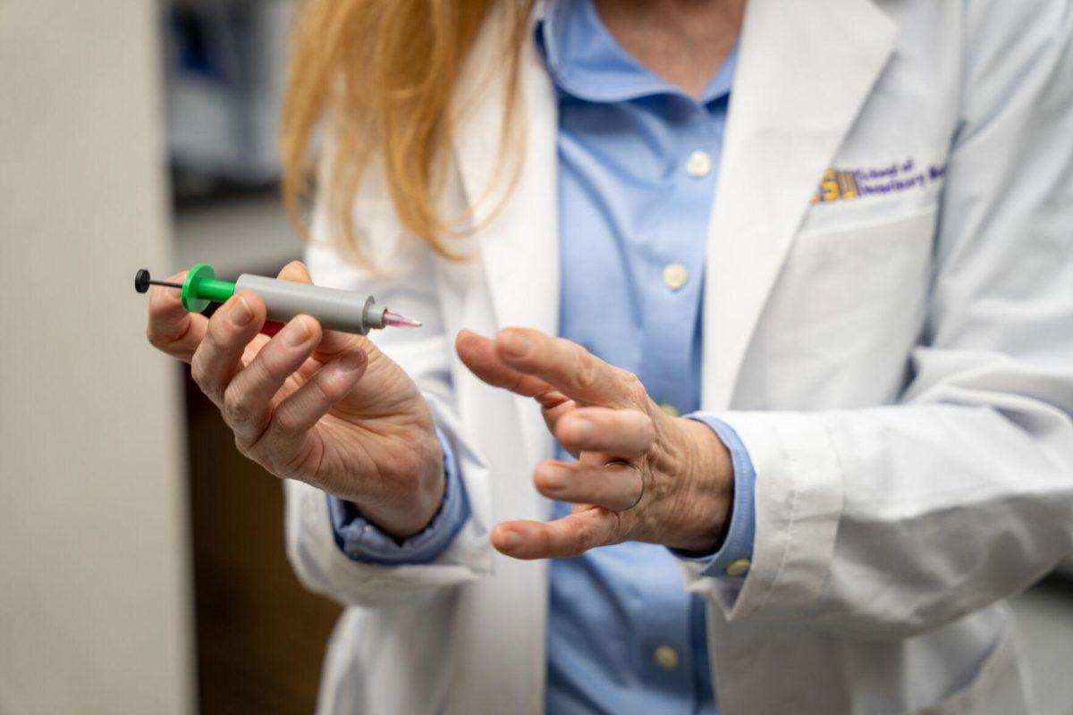 LSU veterinary doctor Mandi Lopez explains her new patented syringe Wednesday, April 17, 2024, at the LSU School of Veterinary Medicine on Skip Bertman Drive in Baton Rouge, La.