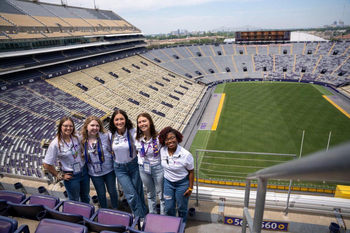 Dance Marathon VP of finance Kacie Francois, VP of membership Allissa Wiggins, President Delaney Mobley, VP of marketing Skye Reynolds, and VP of event management smile Saturday, April 6, 2024 at the LSU Dance Marathon in Tiger Stadium in Baton Rouge, La.