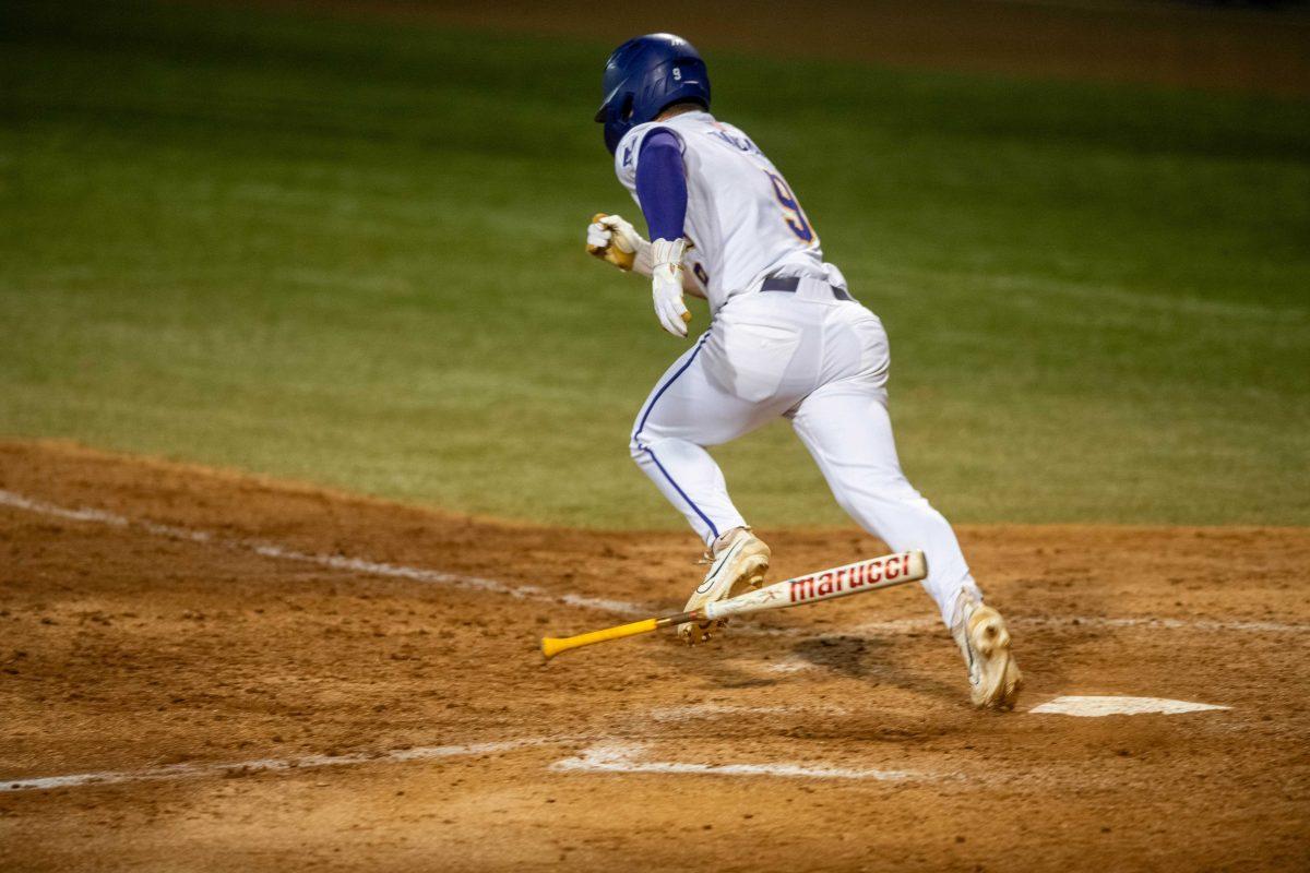 LSU baseball senior outfielder Mac Bingham (9) throws his bat down after hitting during LSU's 6-4 loss against Florida on Saturday, March 23, 2024, at Alex Box Stadium in Baton Rouge, La.