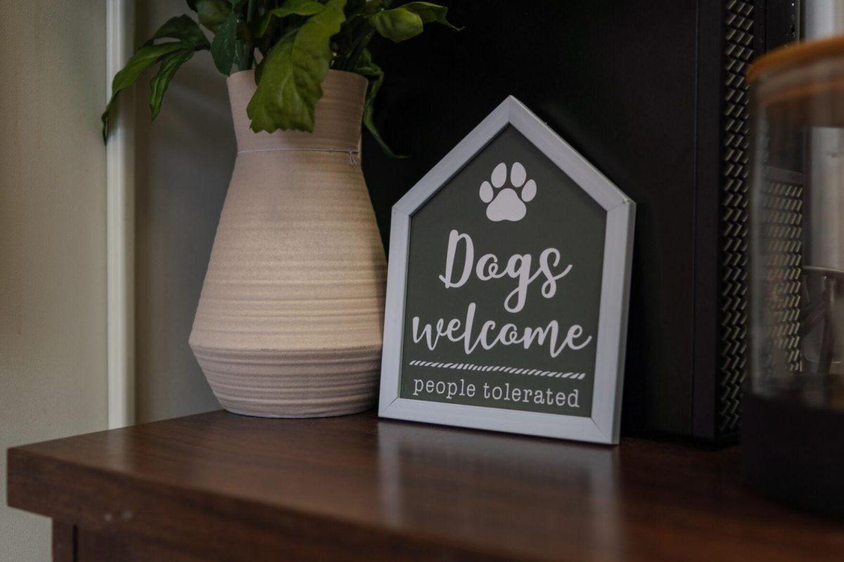 A sign reads "Dog welcome people tolerated" Friday, April 26, 2024, at the doggy daycare facility at the LSU School of Veterinary Medicine in Baton Rouge, La.