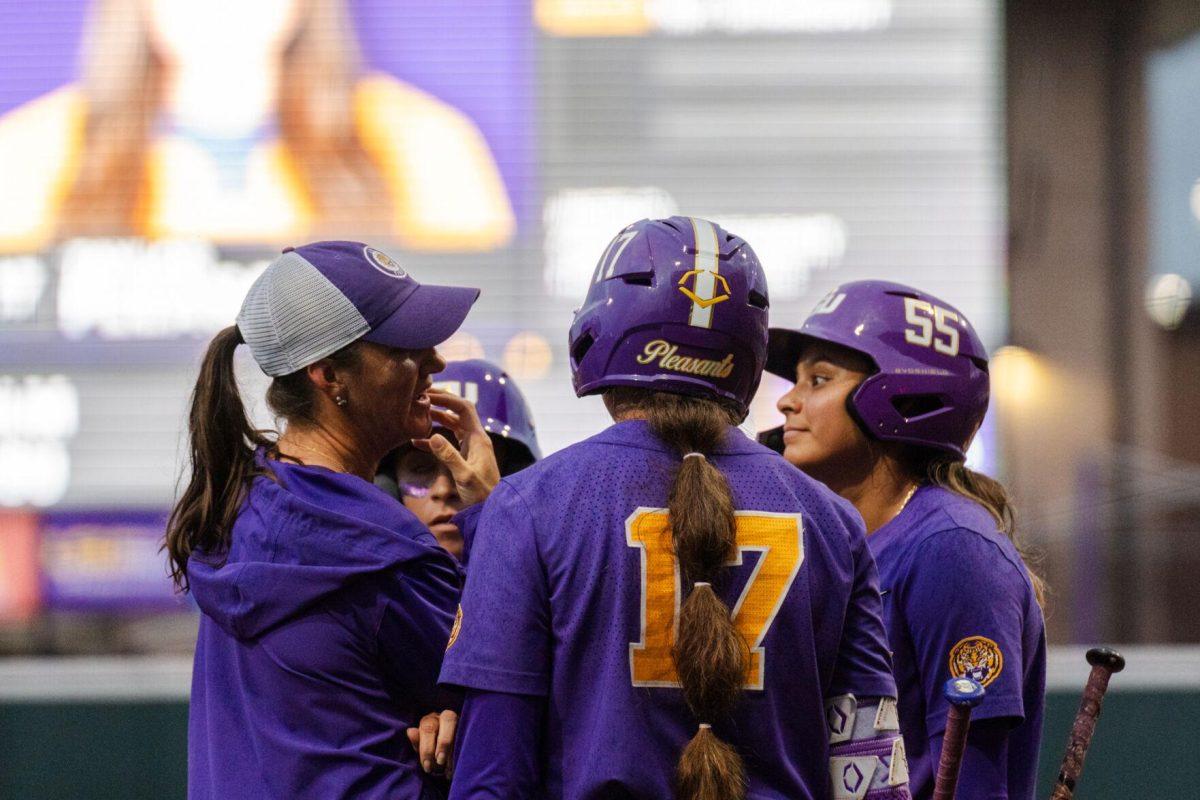 LSU softball head coach Beth Torina meets with the team Tuesday, April 2, 2024, during LSU's 7-4 win against ULM in Tiger Park in Baton Rouge, La.