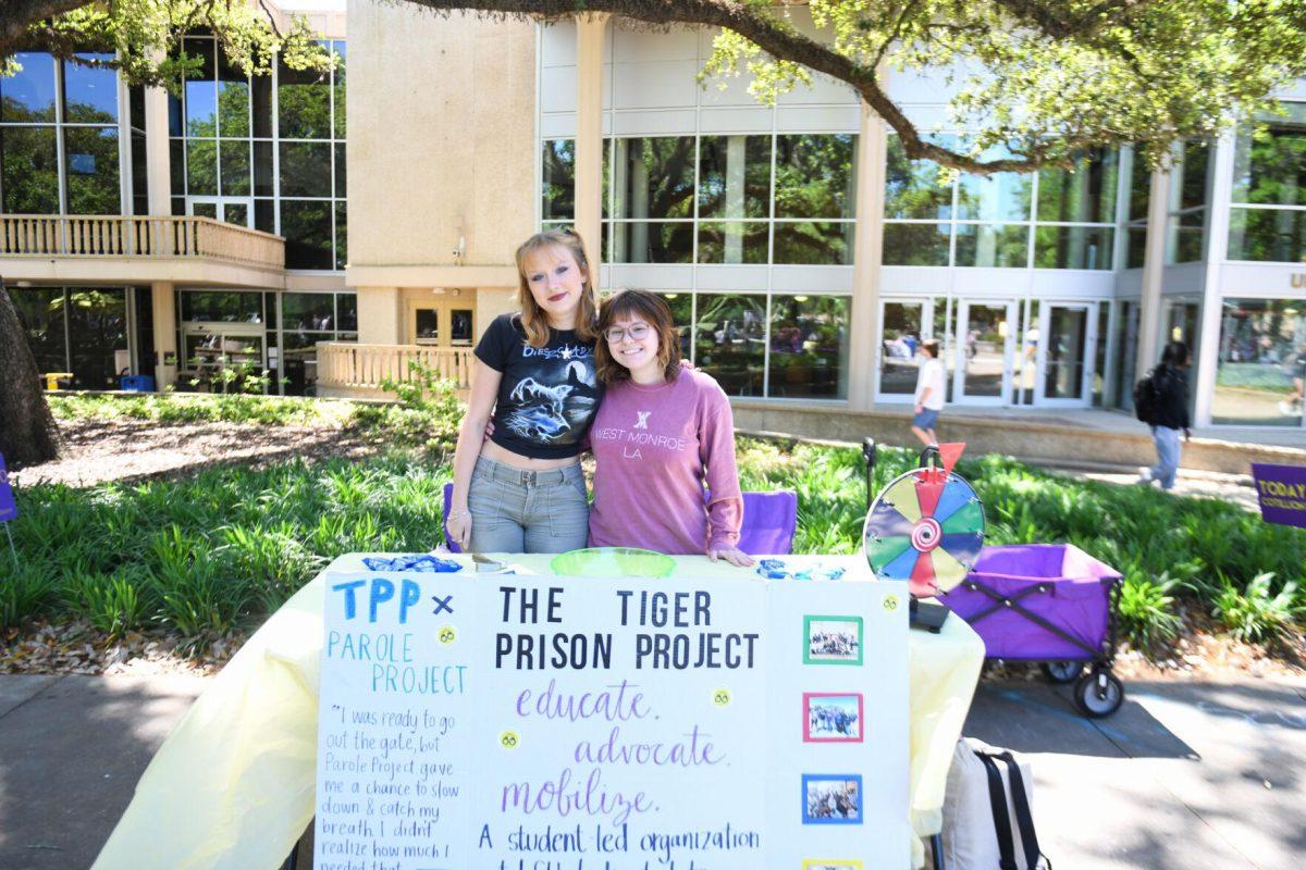 The Tiger Prison Project stands by their table in Free Speech Alley for LSU Round the Block on Wednesday, April 3, 2024, on LSU campus in Baton Rouge, La.