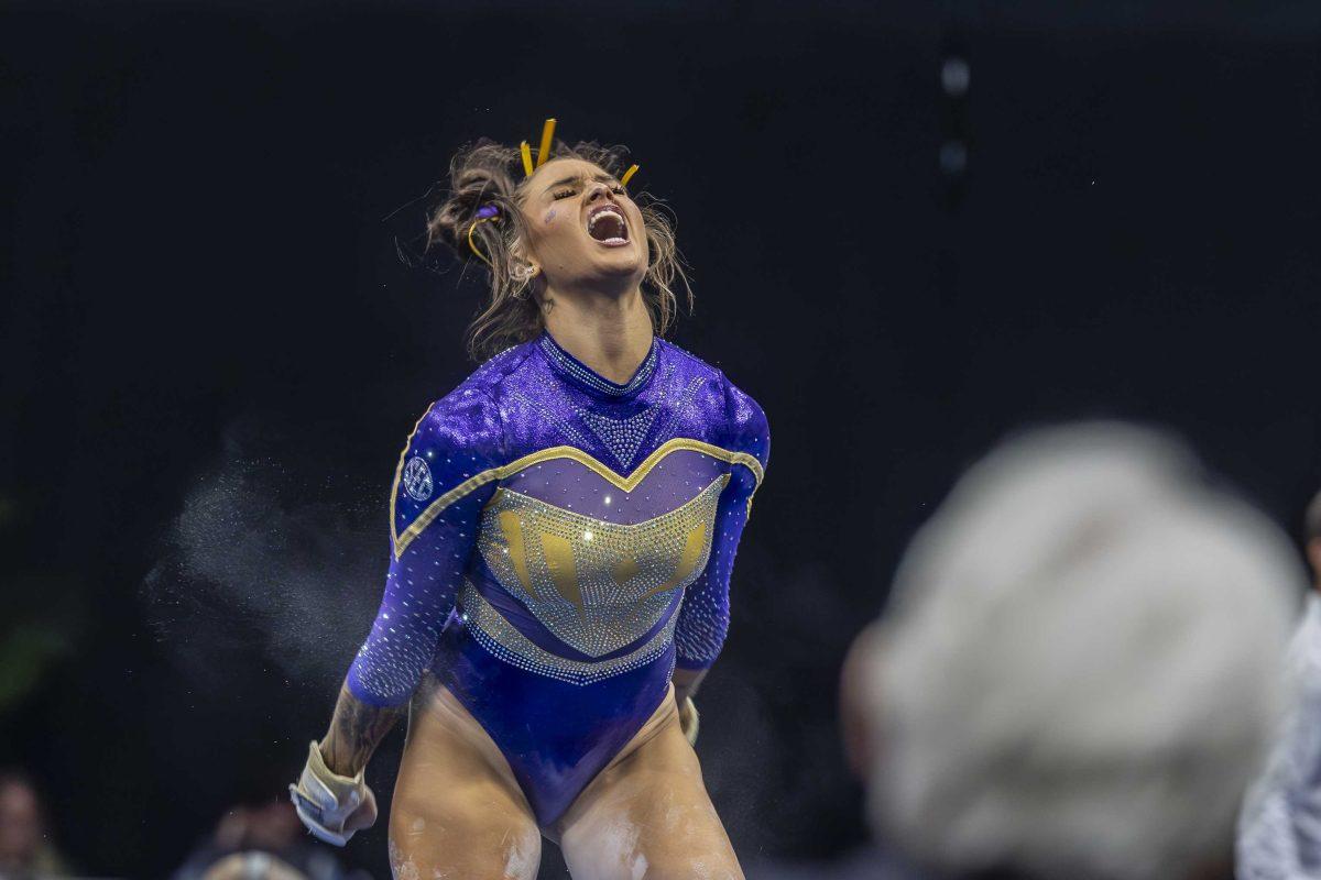 LSU gymnastics junior all-around KJ Johnson celebrates her floor exercise Saturday, March 23, 2024, during LSU's 198.075 victory in the 2024 SEC Gymnastics Championship in the Smoothie King Center in New Orleans, La.