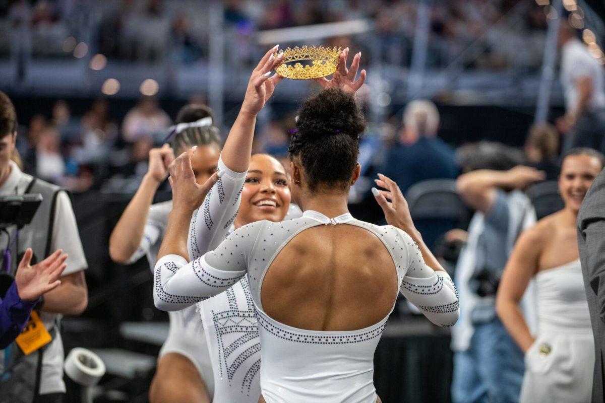 LSU gymnastics freshman all-around Konnor McClain crowns her fellow teammate after their floor routine during the NCAA Gymnastics Championship on Saturday, April 20, 2024, in Fort Worth, Tx.