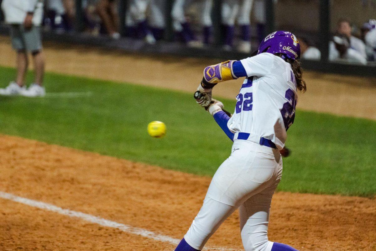 LSU softball freshman infielder Madyson Manning (22) swings for the ball Friday, April 26, 2024, during LSU's 2-1 loss against Arkansas at Tiger Park in Baton Rouge, La.