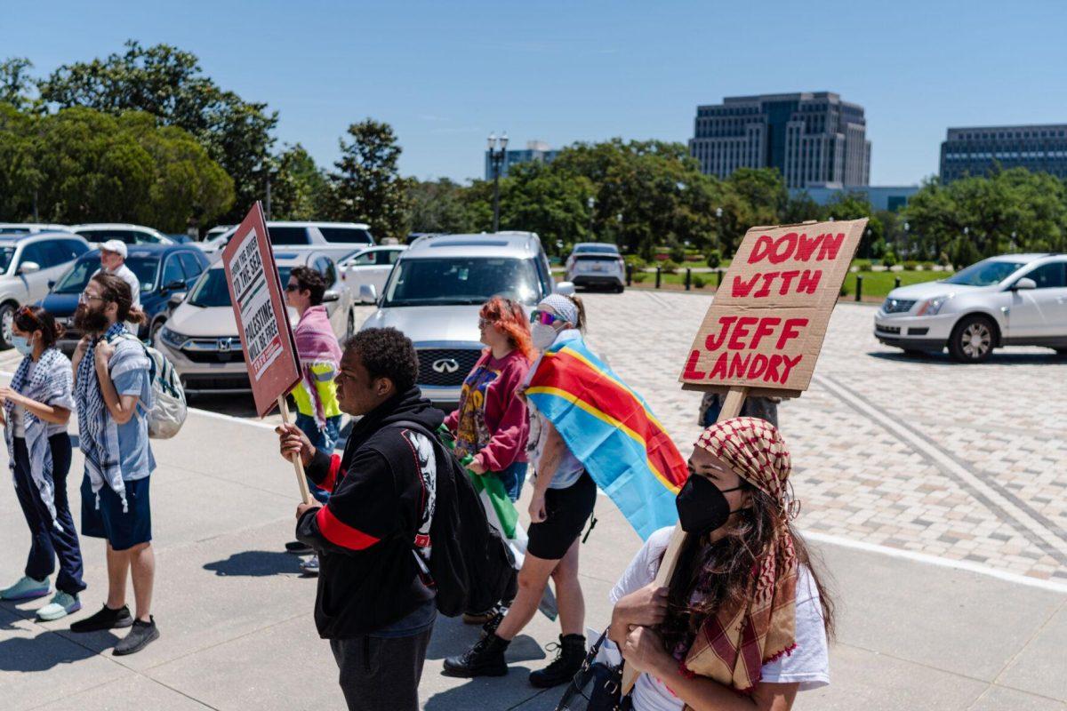 Rally attendees stand in front of the steps Monday, April 22, 2024, at the Louisiana State Capitol in Baton Rouge, La.