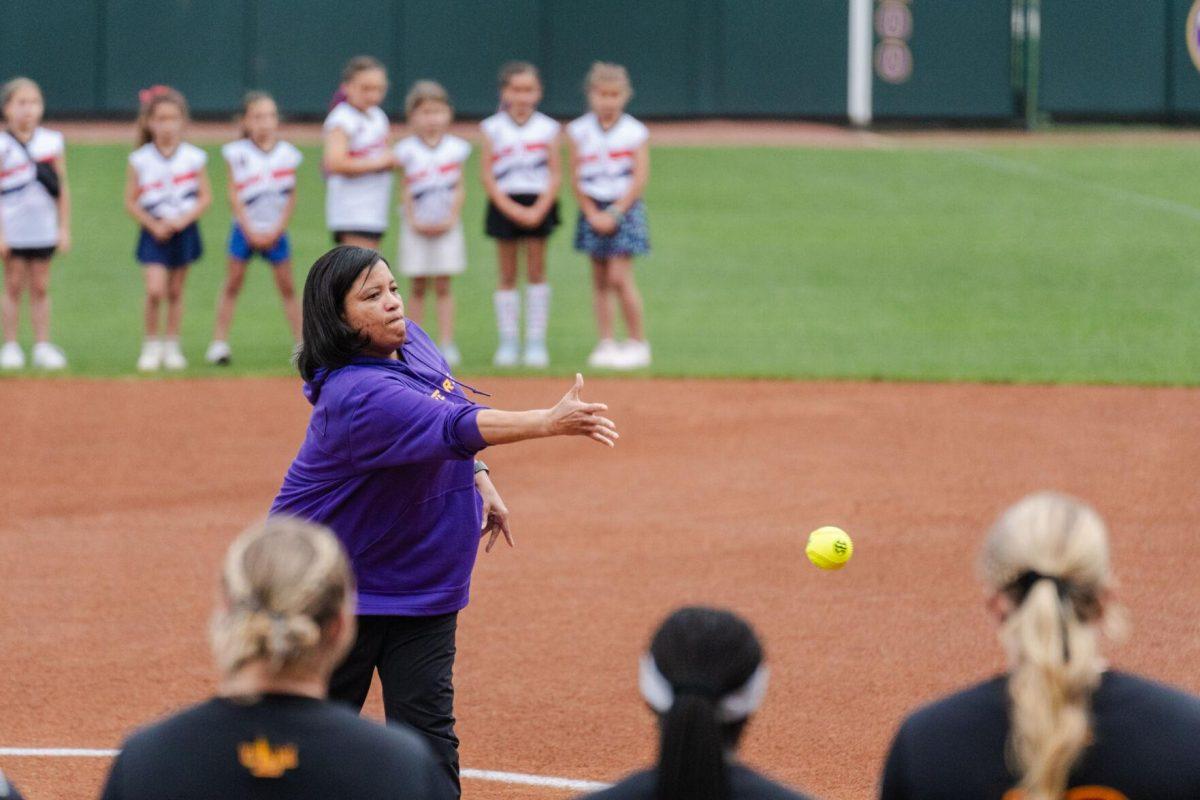 LSU volleyball head coach Tonya Johnson throws out the first pitch Tuesday, April 2, 2024, before LSU's 7-4 win against ULM at Tiger Park in Baton Rouge, La.