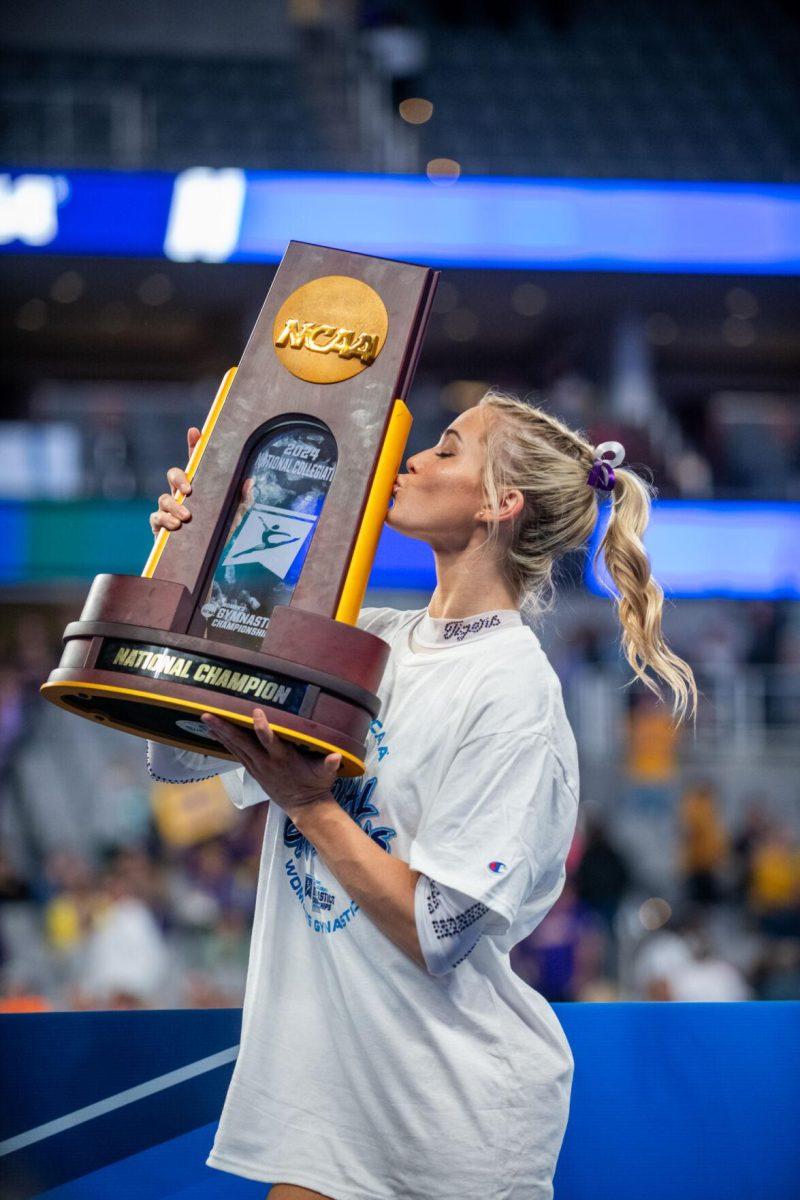 LSU gymnastics Olivia Dunne kisses the trophy following LSU's NCAA Championship win on Saturday, April 20, 2024, in Fort Worth, Tx.