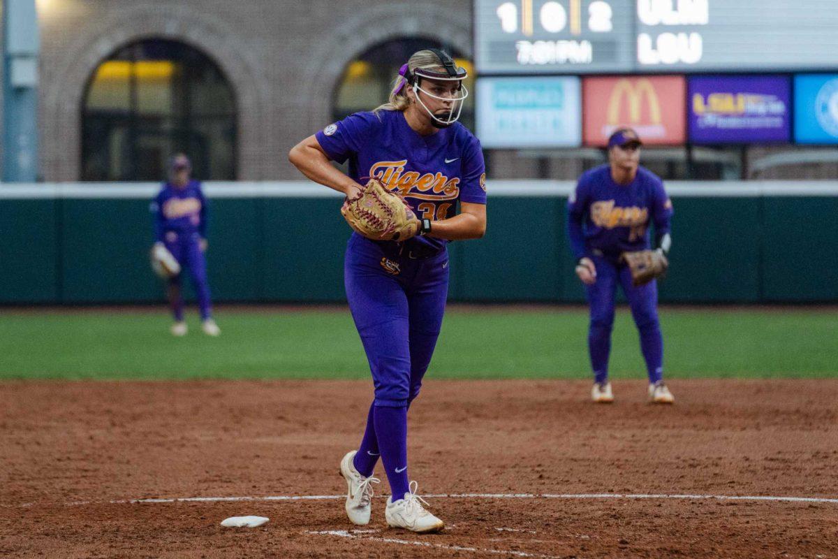 LSU softball junior pitcher Raelin Chaffin (34) begins her windup Tuesday, April 2, 2024, during LSU's 7-4 win against ULM in Tiger Park in Baton Rouge, La.