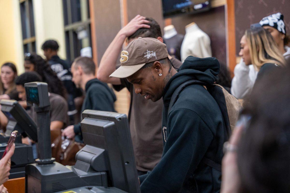 Travis Scott works the register Thursday, April 4, 2024, at the Barnes &amp; Nobles at LSU in Baton Rouge, La.