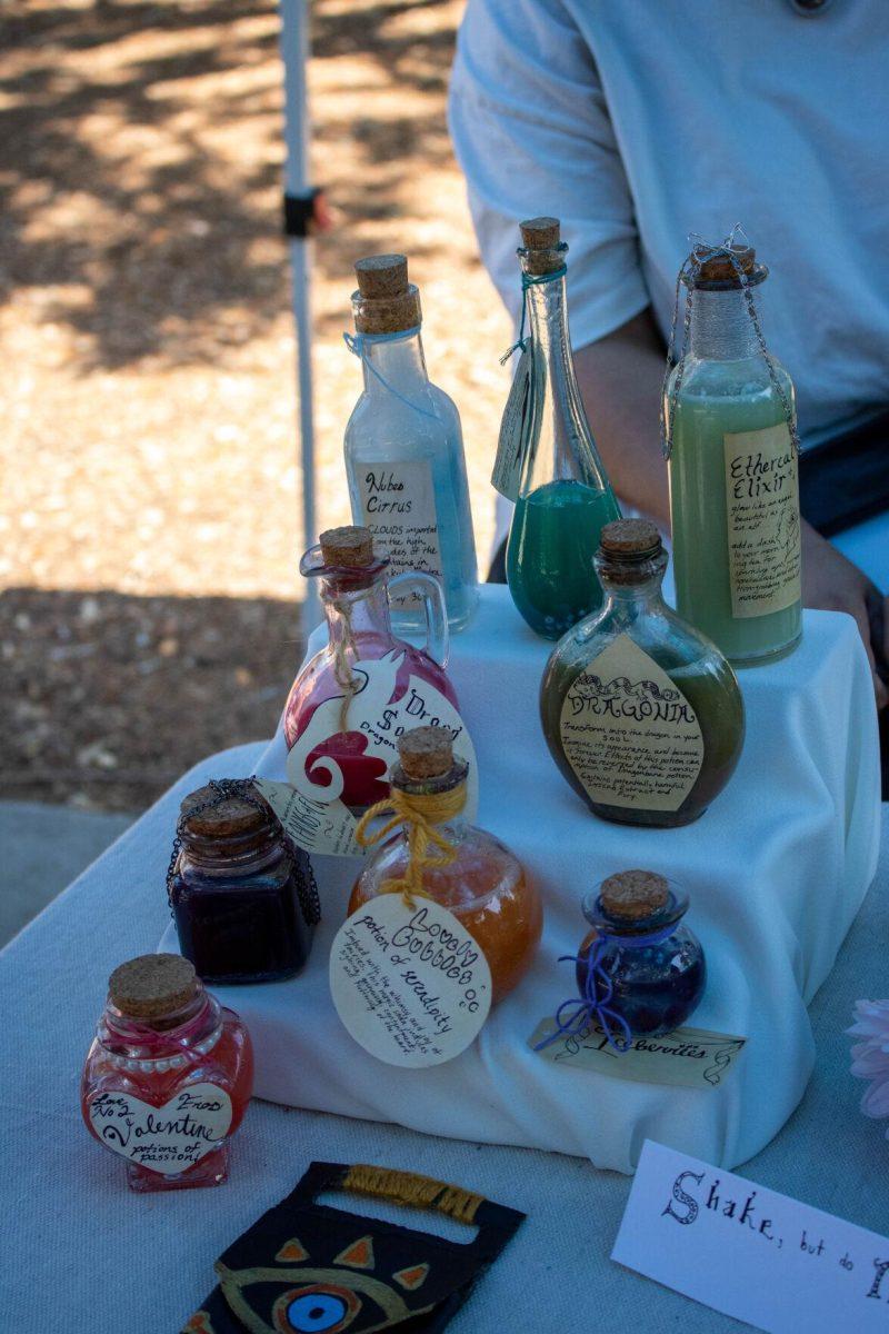 A students creation of 'potions' sits on the table on Wednesday, April 24, 2024, in Free Speech Alley on LSU's campus.