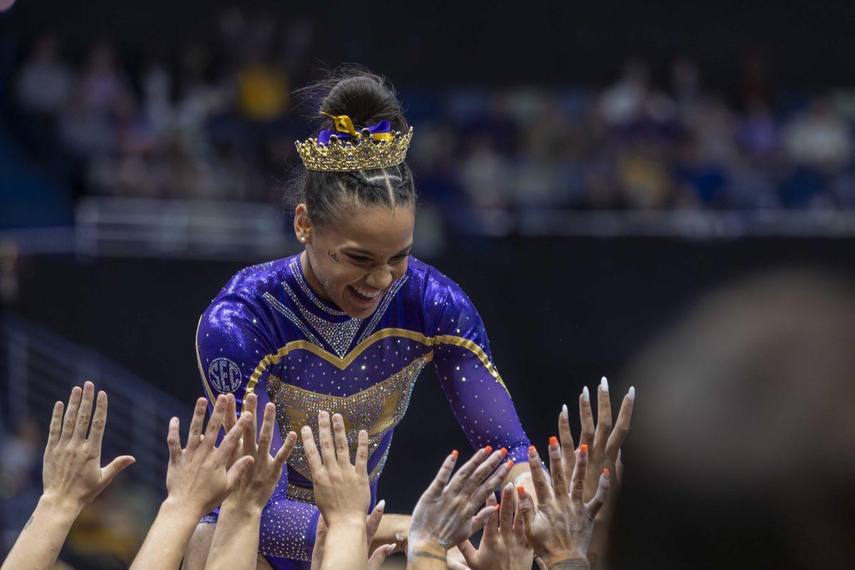 LSU gymnastics senior Haleigh Bryant celebrates her floor exercise with her teammates Saturday, March 23, 2024, during LSU's 198.075 victory in the 2024 SEC Gymnastics Championship in the Smoothie King Center in New Orleans, La.