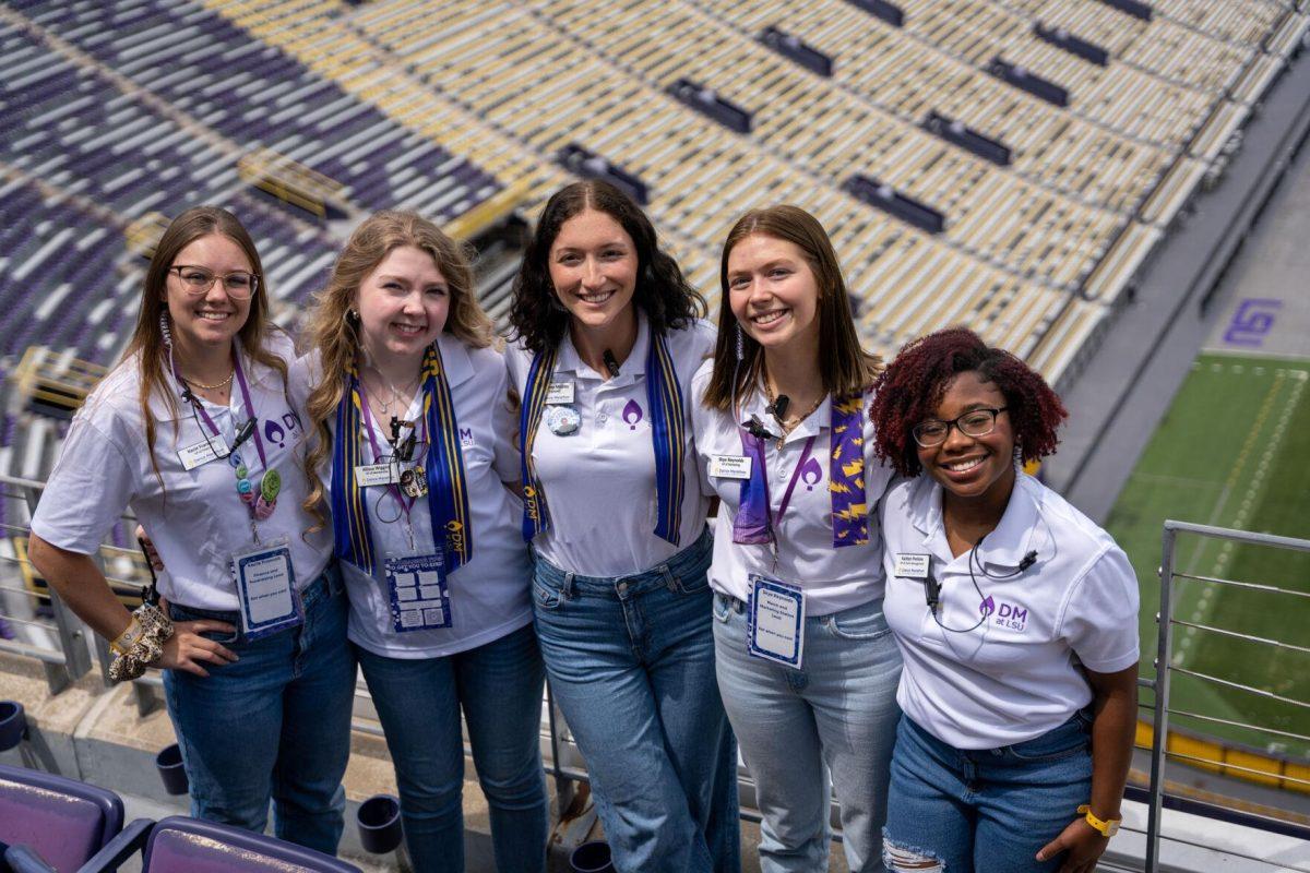 Dance Marathon VP of finance Kacie Francois, VP of membership Allissa Wiggins, President Delaney Mobley, VP of marketing Skye Reynolds, and VP of event management smile Saturday, April 6, 2024 at the LSU Dance Marathon in Tiger Stadium in Baton Rouge, La.