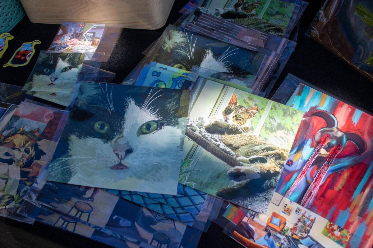 A student designed prints of her cat for the ar tsale on Wednesday, April 24, 2024, in Free Speech Alley on LSU's campus.