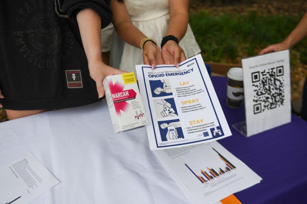 The Collegiate Recovery Program and ROAR-UP LSU hand out free Narcan in Free Speech Alley on Thursday, April 18, 2024, on LSU campus in Baton Rouge, La.