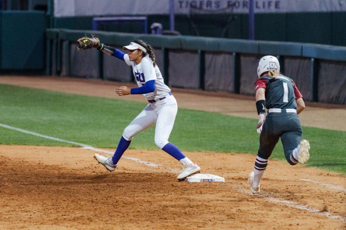 LSU softball graduate student utility Raeleen Gutierrez (55) catches the out Friday, April 26, 2024, during LSU's 2-1 loss against Arkansas at Tiger Park in Baton Rouge, La.