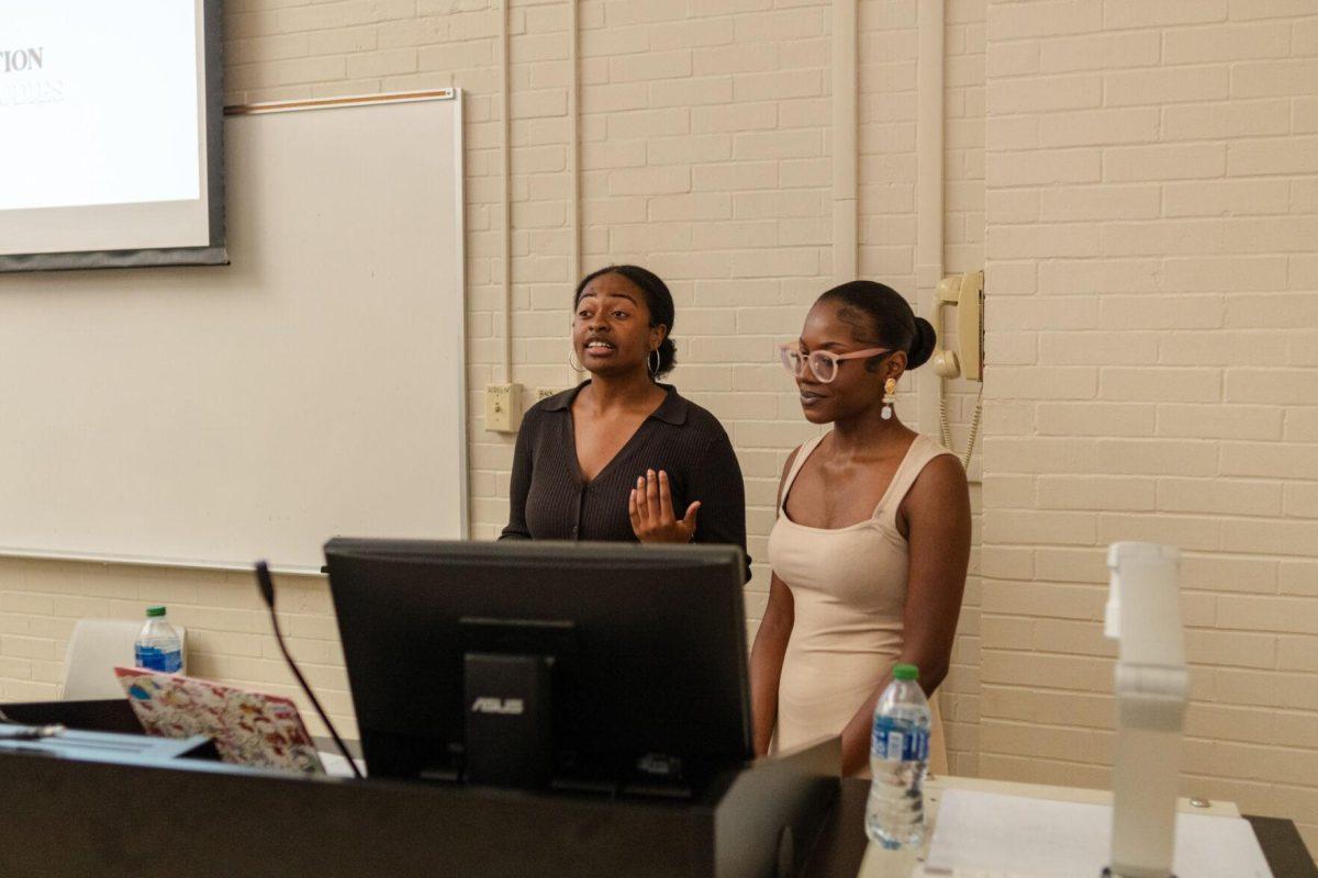 Sy'rai Adams (left) and Claudia Bell (right) open up the Black Femicide Panel Wednesday, April 17, 2024, inside Coates Hall on LSU's campus.