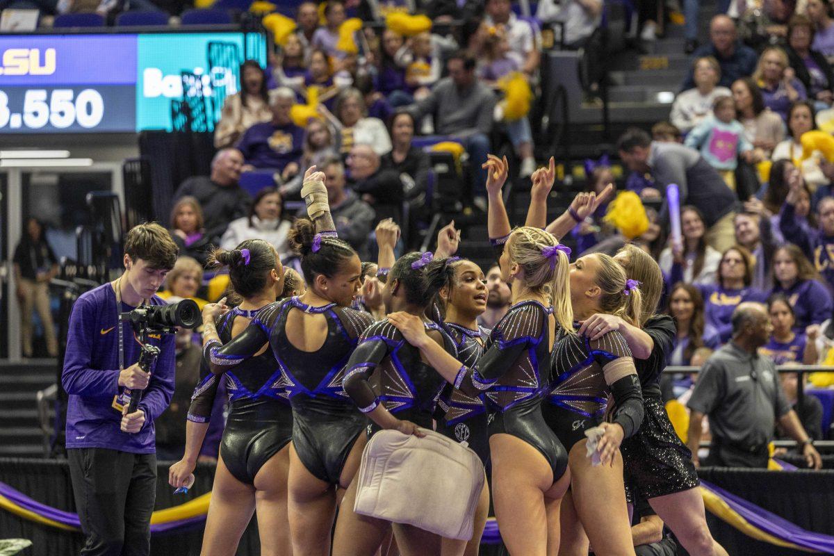 The LSU gymnastics team lets out a cheer Friday, March 1, 2024, during LSU's 198.325-197.325 win over Alabama in the Pete Maravich Assembly Center.