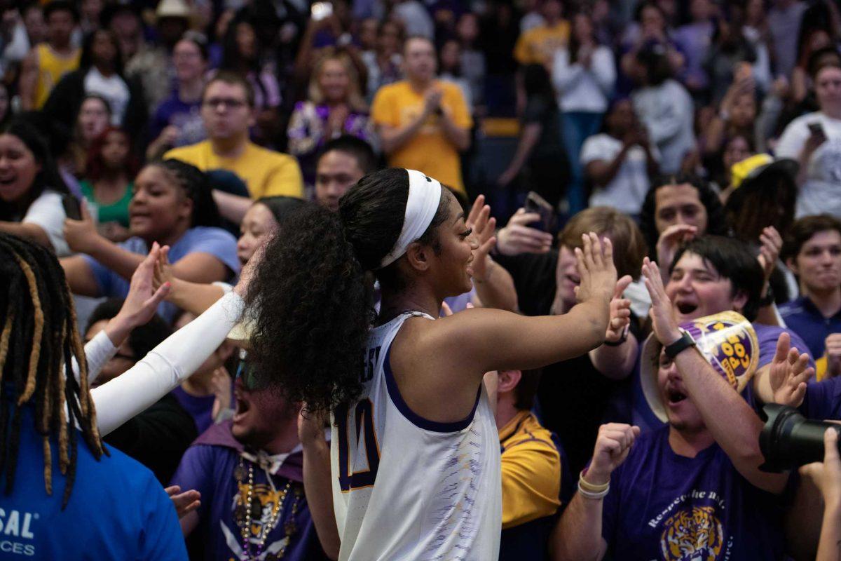 LSU women&#8217;s basketball junior forward Angel Reese (10) high-fives the student section Sunday, March 24, 2024, during LSU&#8217;s 83-56 second-round NCAA tournament win against Middle Tennessee at the Pete Maravich Center in Baton Rouge, La.