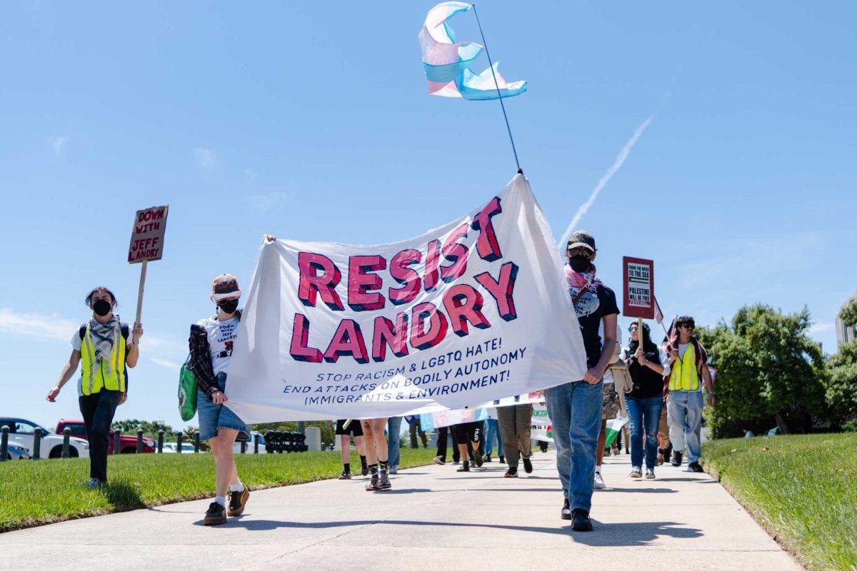 Rally attendees march from the Capitol Monday, April 22, 2024, at the Louisiana State Capitol in Baton Rouge, La.