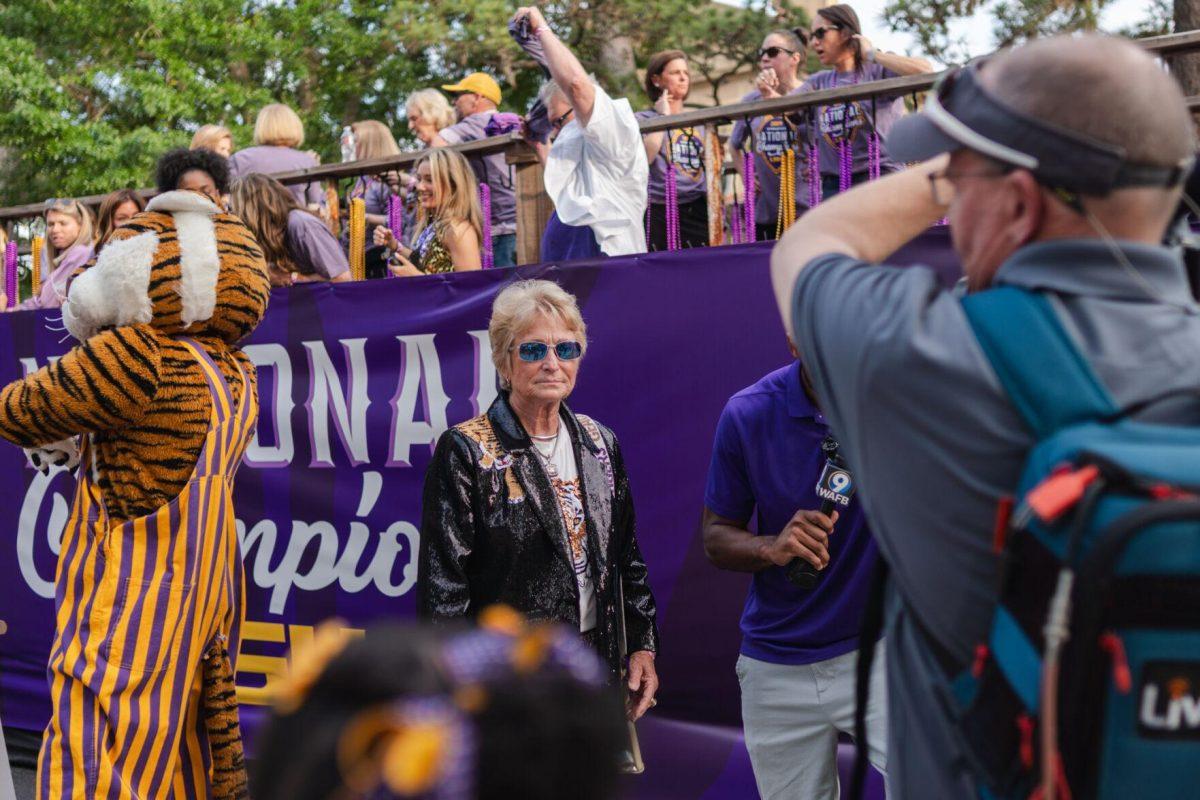 Former LSU gymnastics head coach D-D Breaux readies for a tv interview Wednesday, April 24, 2024, at the LSU gymnastics championship parade on LSU's campus in Baton Rouge, La.