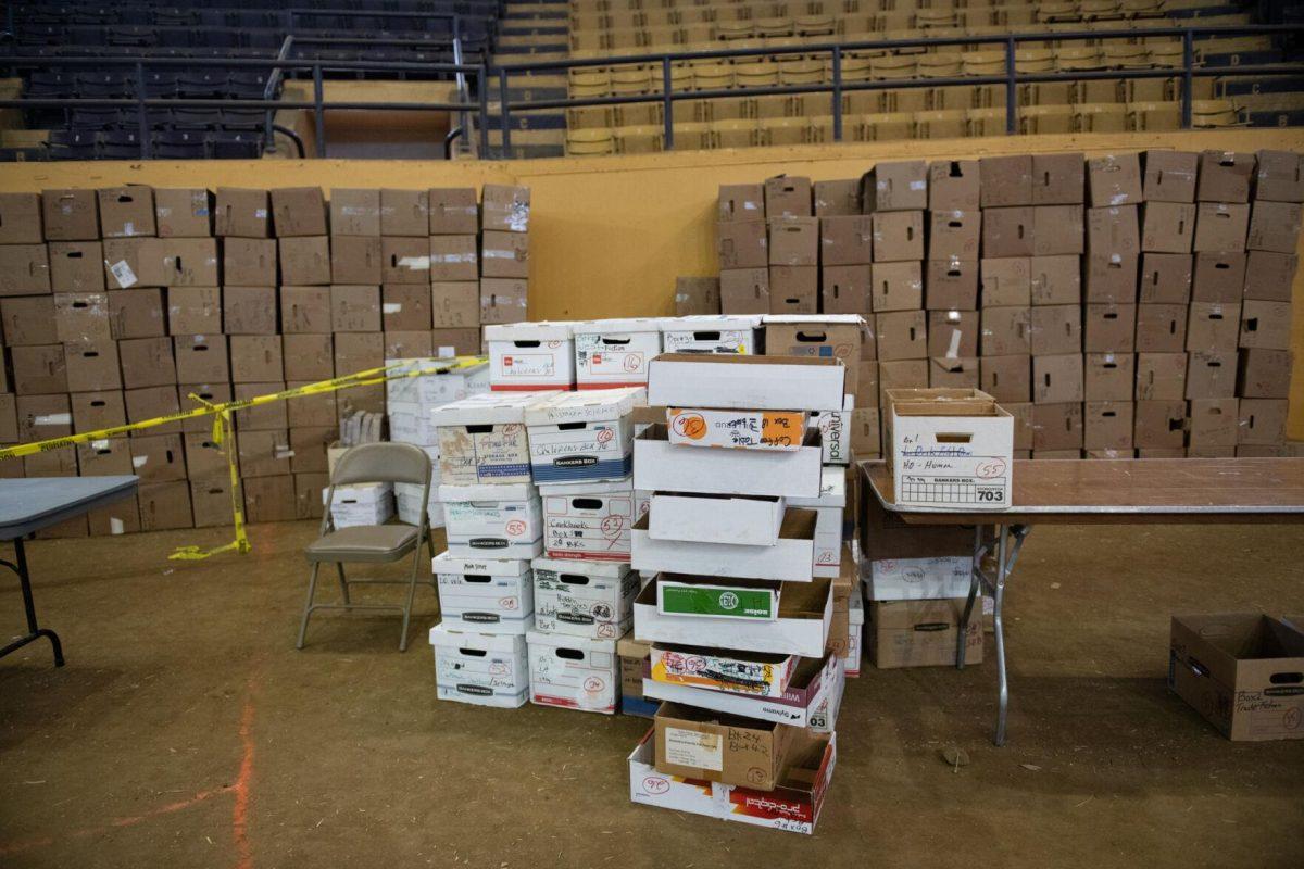 Towers of empty boxes sit Sunday, April 14, 2024, for attendees to use to carry books during the Friends of the LSU Libraries Book Bazaar at the John M. Parker Agricultural Coliseum in Baton Rouge, La.