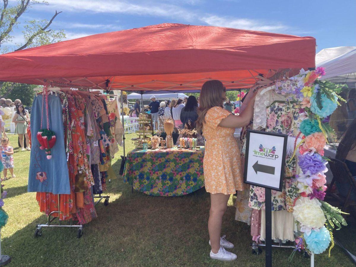 Shoppers browse at Time War Boutique's pop-up at the Flower Fest