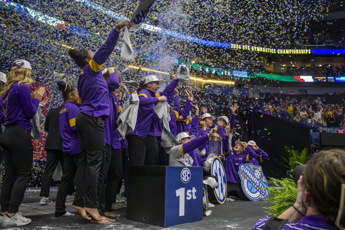 The LSU gymnastics team celebrates their championship win Saturday, March 23, 2024, following LSU's 198.075 victory in the 2024 SEC Gymnastics Championship in the Smoothie King Center, New Orleans, La.