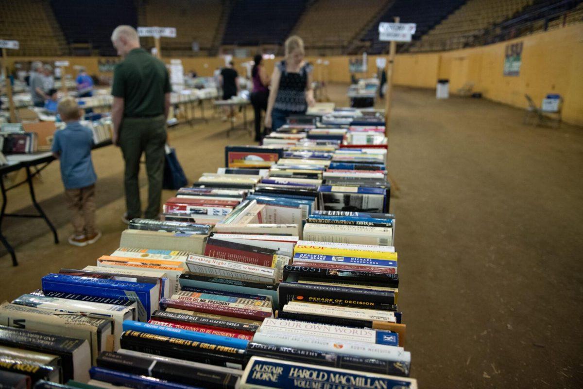 Historical books line up on a table Sunday, April 14, 2024, during the Friends of the LSU Libraries Book Bazaar at the John M. Parker Agricultural Coliseum in Baton Rouge, La.