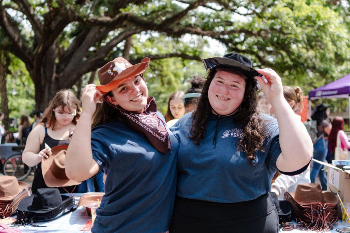 LSU political communication junior Madison Keyser (left) and political science senior Julianna Jackson (right) smile for a picture Tuesday, April 2, 2024, at the College Council Rodeo on Tower Drive on LSU's campus.