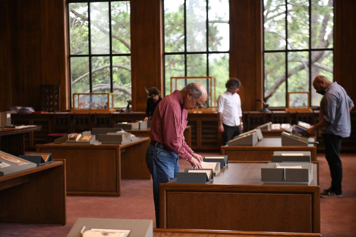 Visitors look at pieces of poetry during the Afternoon in the Archives: The Wyatt Houston Day Collection of Poetry by African Americans event at Hill Memorial Library on Thursday, April 18, 2024, on LSU campus in Baton Rouge, La.