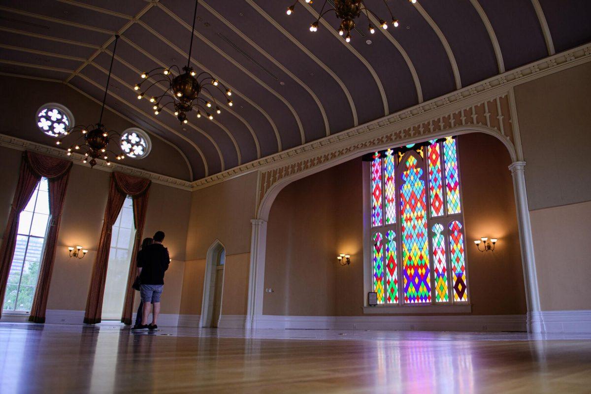 A couple admires the ballroom on Thursday, April 18, 2024, at Louisiana's Old State Capitol in Baton Rouge, La.