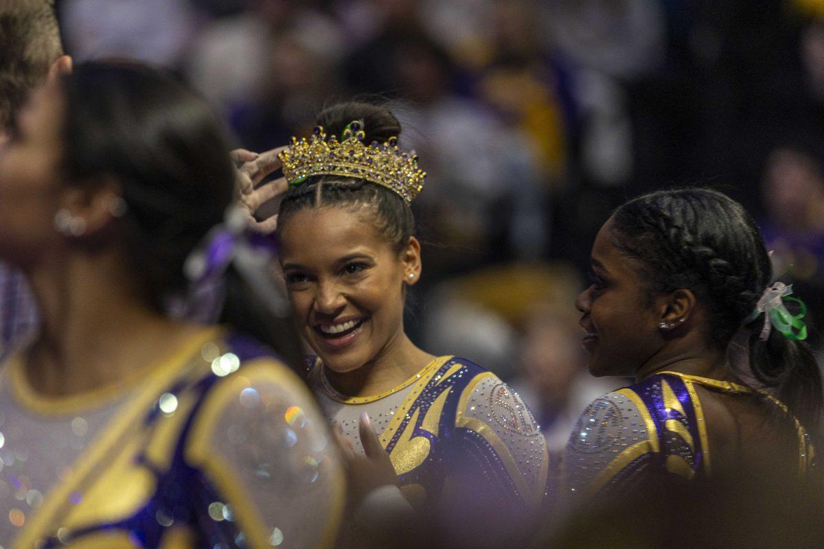 LSU gymnastics all-around senior Haleigh Bryant adjusts her crown Friday, Jan. 19, 2024, during LSU&#8216;s 198.125 - 197.600 victory over the University of Kentucky in the Pete Maravich Assembly Center.