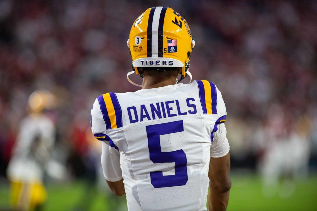 LSU football senior quarterback Jayden Daniels (5) warms up on Saturday, Nov. 5, 2023, before LSU's 42-28 loss against Alabama in Bryant-Denny stadium in Tuscaloosa, Al.