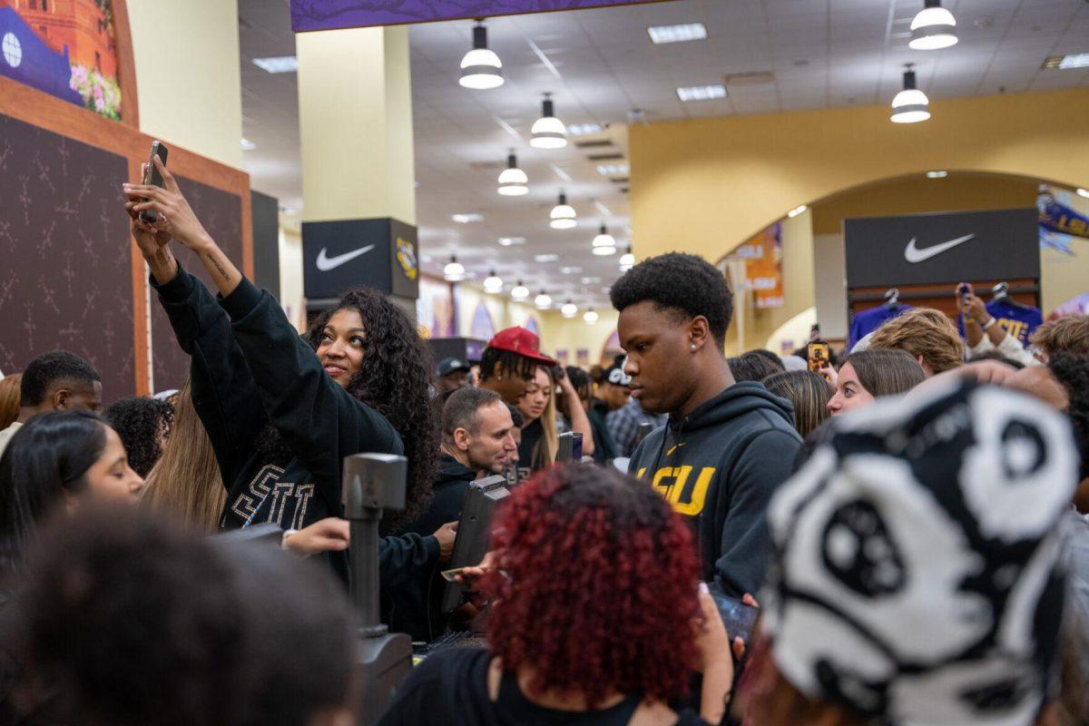 Angel Reese takes a selfie Thursday, April 4, 2024, at the Barnes &amp; Nobles at LSU in Baton Rouge, La.