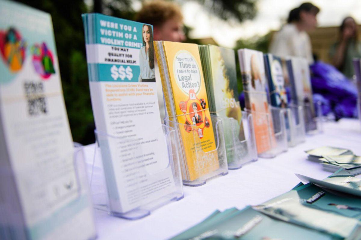 Brochures fill the booth on Tuesday, April 16, 2024, in front of Memorial Tower in Baton Rouge, La.