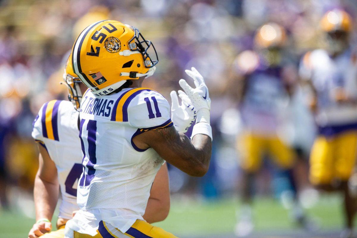 LSU football junior wide receiver Zavion Thomas (11) looks and prepares to catch the ball during the LSU Spring Football game on Saturday, April 13, 2024, in Tiger Stadium.