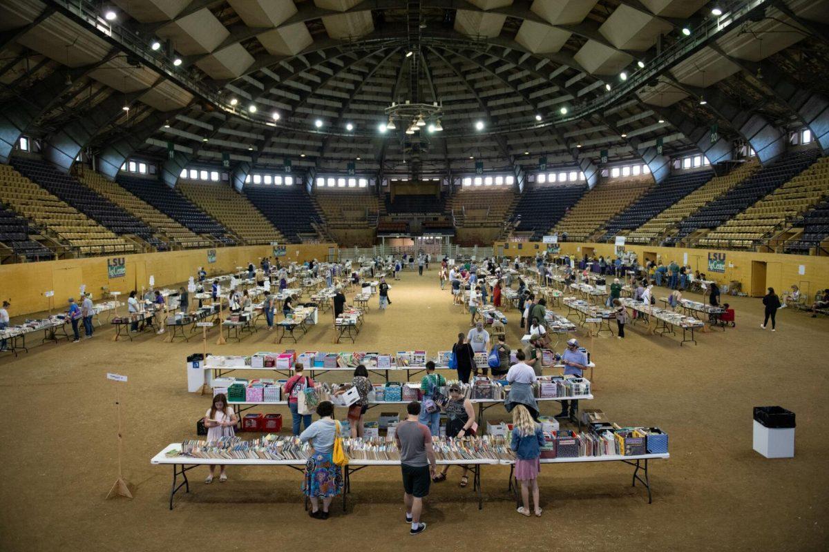 Books and readers fill the venue Sunday, April 14, 2024, during the Friends of the LSU Libraries Book Bazaar at the John M. Parker Agricultural Coliseum in Baton Rouge, La.