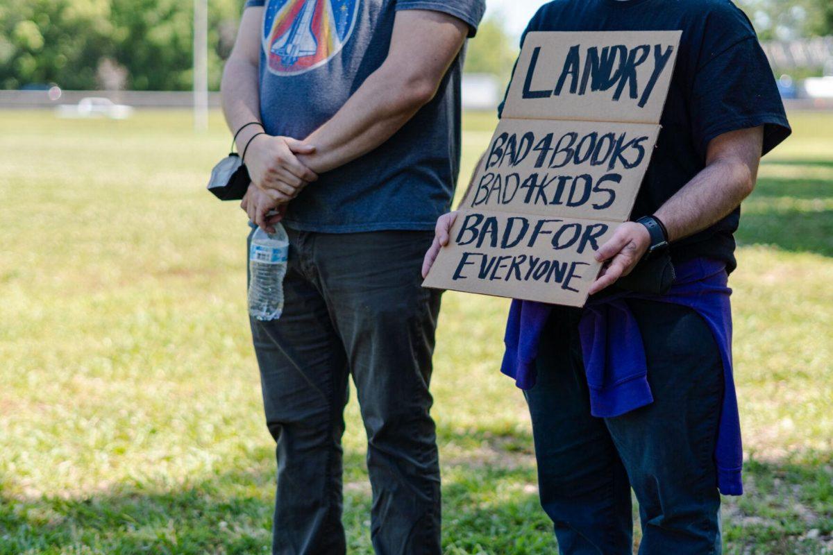 A sign reads "Ladnry Bad 4 Books Bad 4 Kids Bad for Everyone" Monday, April 22, 2024, during a protest outside the Governor's mansion in Baton Rouge, La.