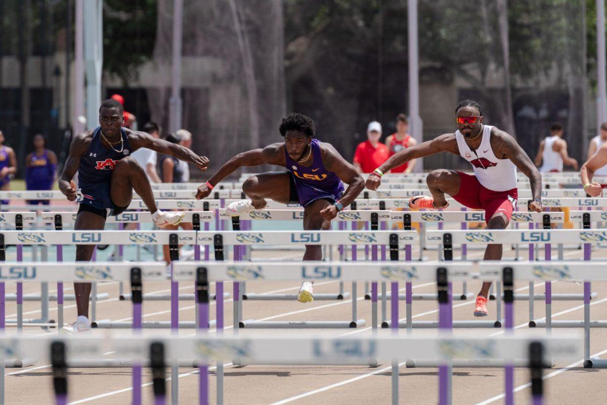 LSU track and field sprints sophomore Jahiem Stern clears the hurdle Saturday, April 27, 2024, at the LSU Invitational in the Bernie Moore Track Stadium in Baton Rouge, La.