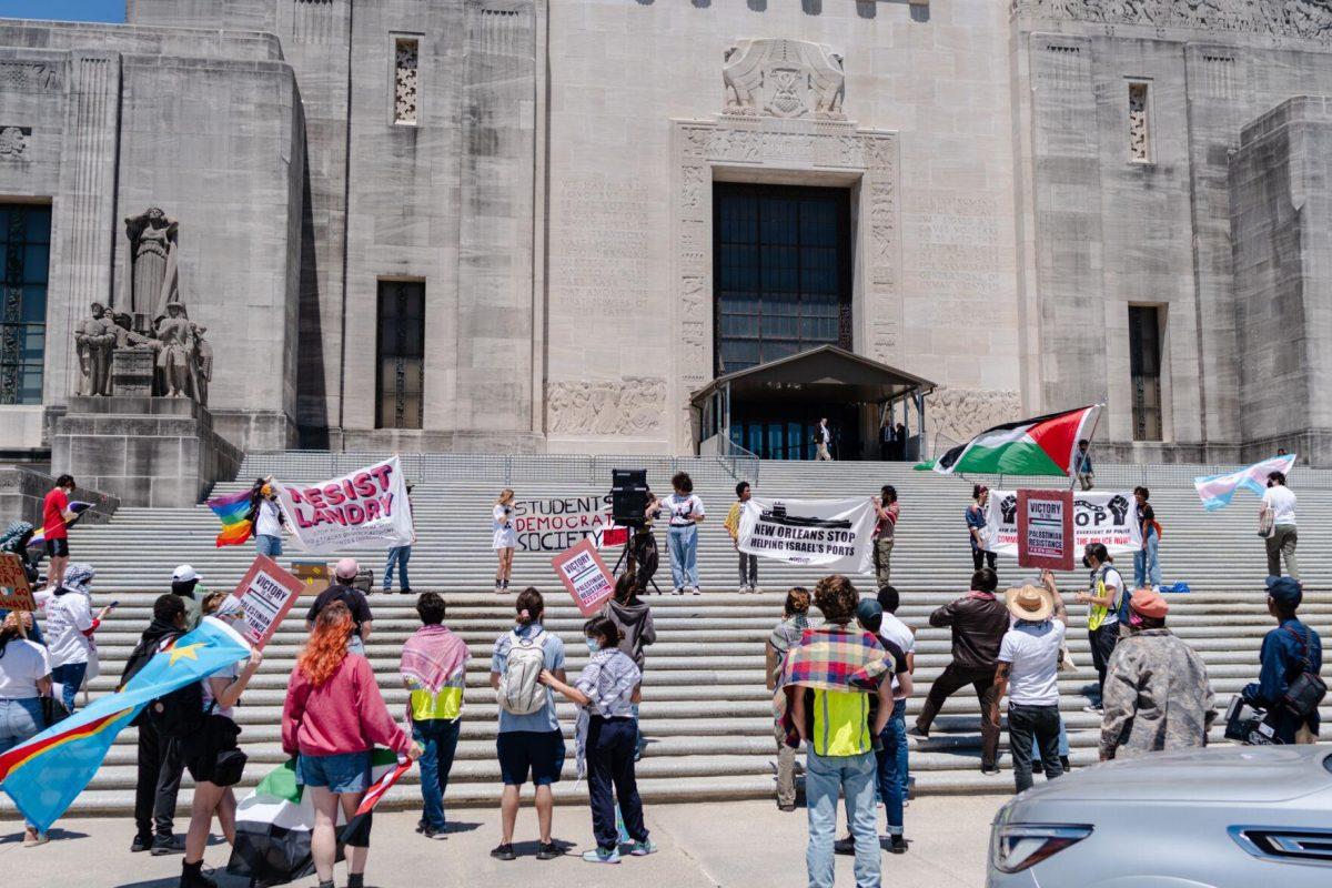 Rally attendees stand on the steps Monday, April 22, 2024, at the Louisiana State Capitol in Baton Rouge, La.