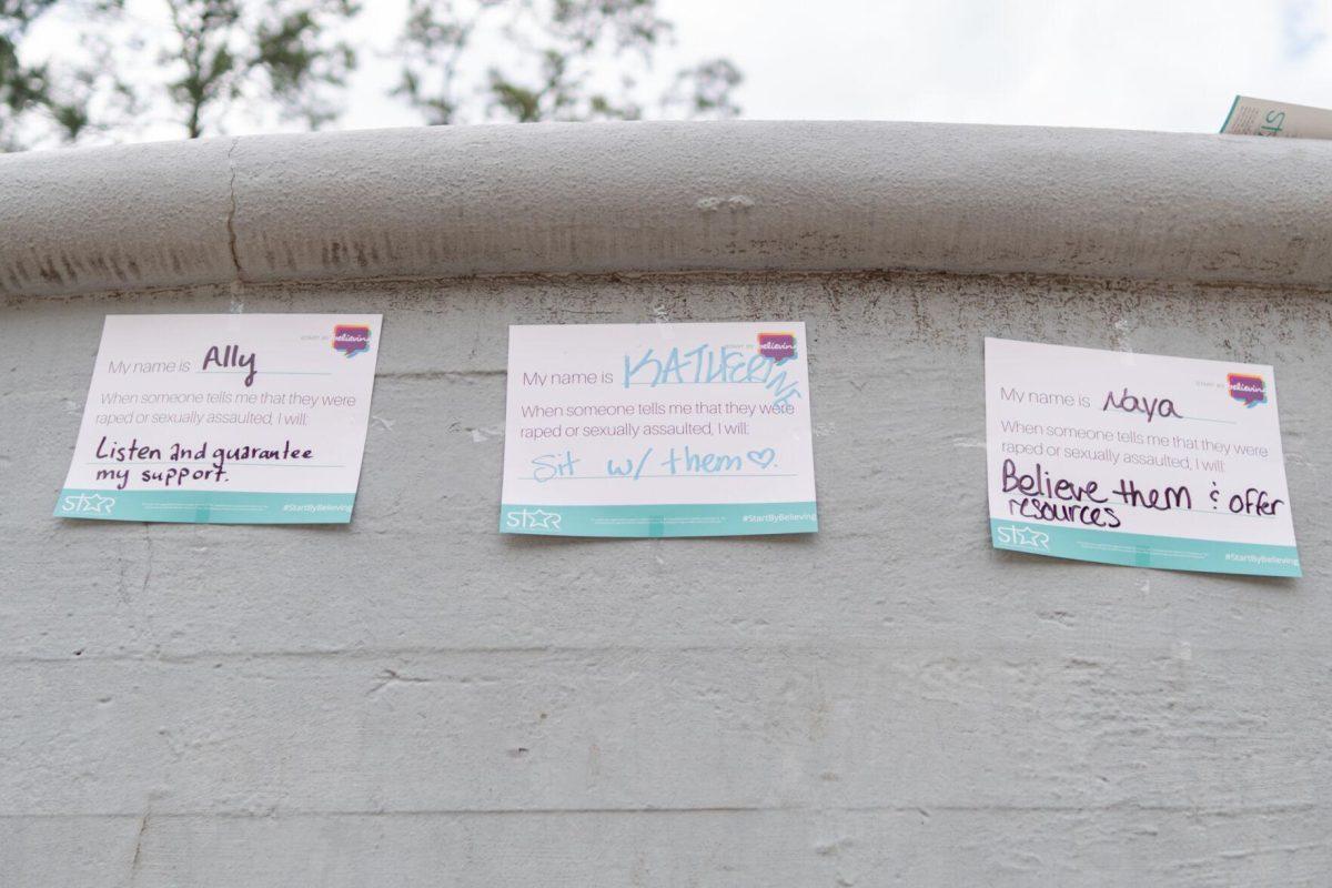 Papers read what various people would do to support someone who reveals an experience of sexual assault Wednesday, April 24, 2024, during a Denim Day event at the LSU amphitheater.