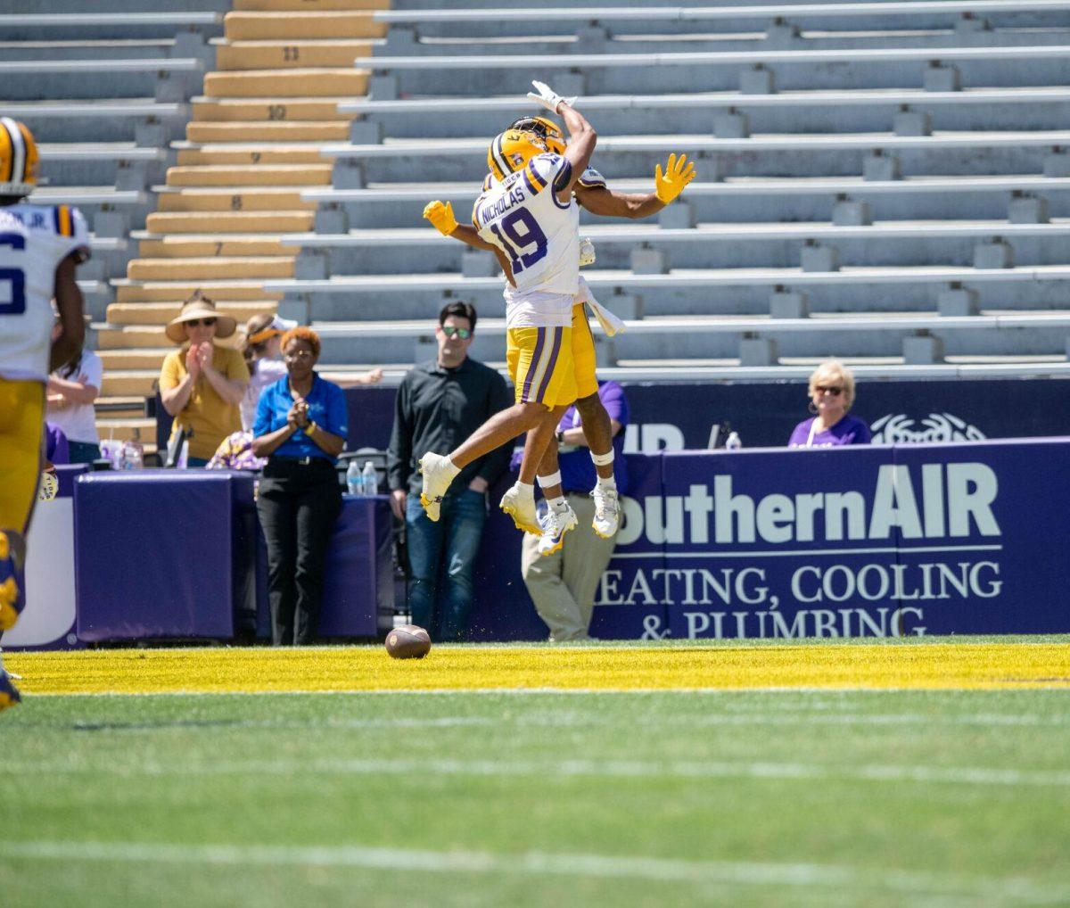 LSU football redshirt sophomore wide receiver Javen Nicholas (19) jumps to celebrate a touchdown during the LSU Spring Football game on Saturday, April 13, 2024, in Tiger Stadium.