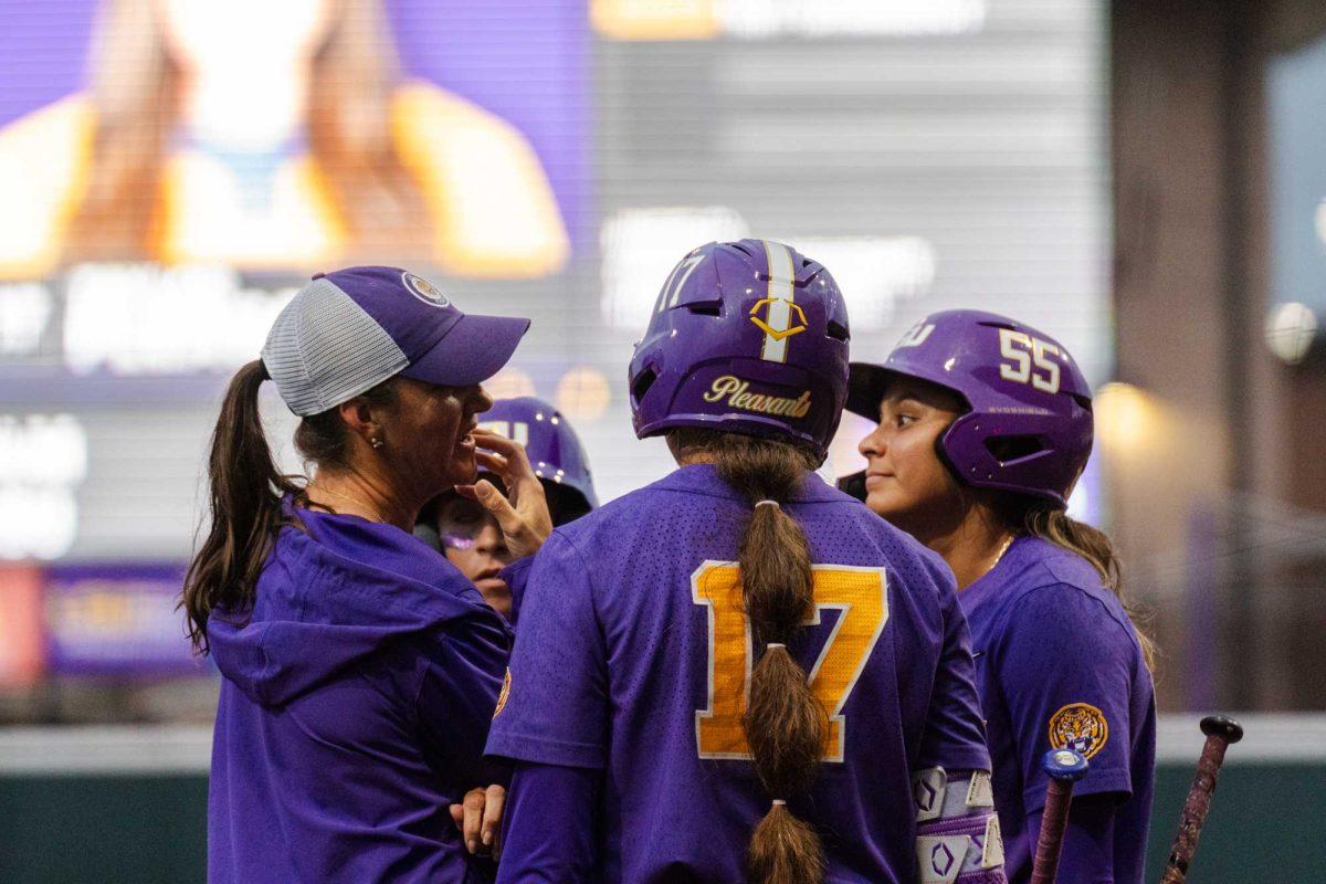 LSU softball head coach Beth Torina meets with the team Tuesday, April 2, 2024, during LSU's 7-4 win against ULM in Tiger Park in Baton Rouge, La.