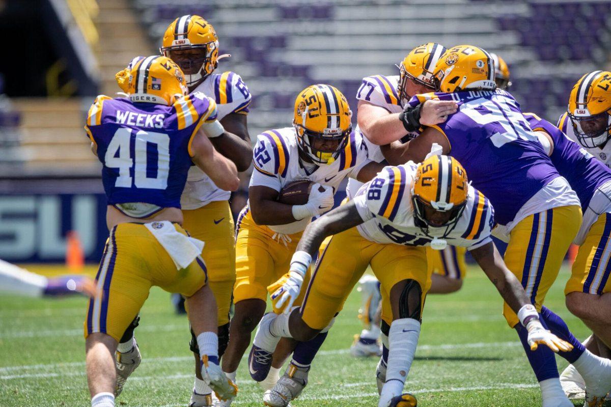 LSU football redshirt freshman running back Joseph Ebun (32) runs through with the ball during the LSU Spring Football game on Saturday, April 13, 2024, in Tiger Stadium.