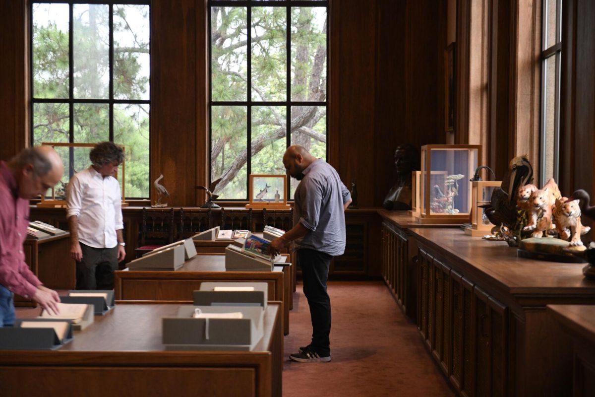 Visitors look at pieces of poetry during the Afternoon in the Archives: The Wyatt Houston Day Collection of Poetry by African Americans event at Hill Memorial Library on Thursday, April 18, 2024, on LSU campus in Baton Rouge, La.