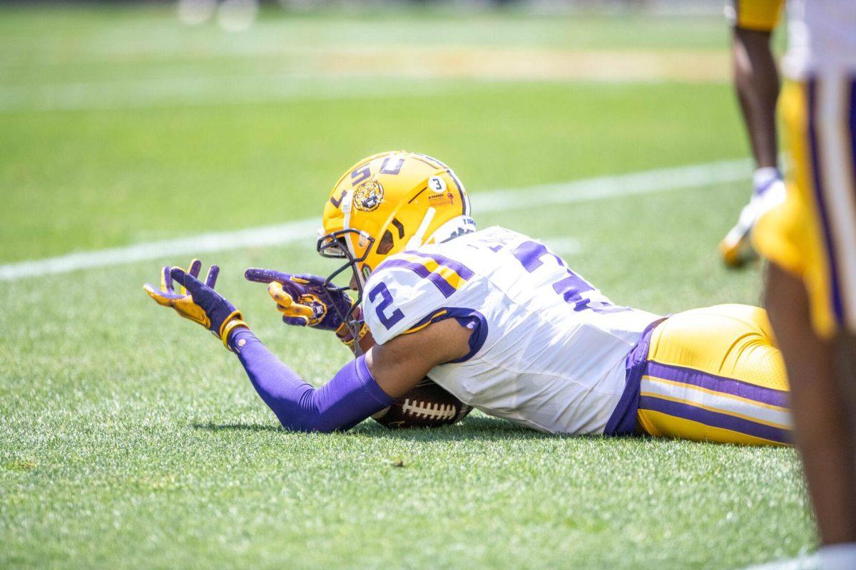 LSU football 5th-year senior wide receiver Kyren Lacy (2) pretends to hold up a sniper to celebrate jokingly during the LSU Spring Football game on Saturday, April 13, 2024, in Tiger Stadium.